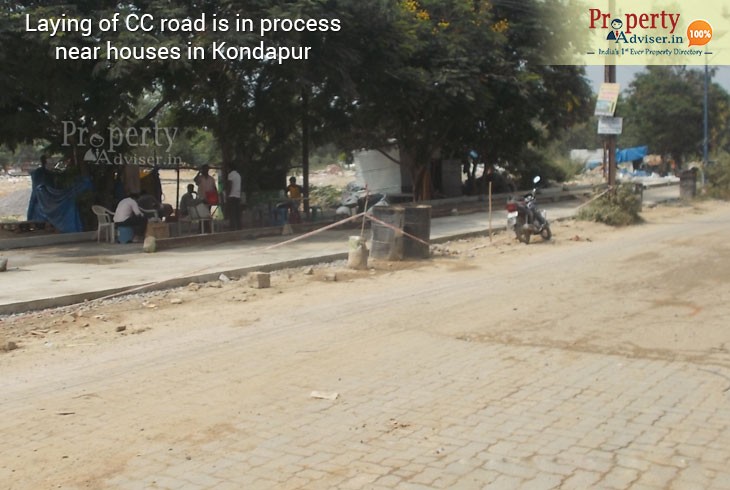 Laying of CC road is under process near Residential houses in Kondapur
