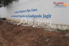 Laying of Manjeera Pipe Lines near BandlagudaJagir Residential Properties
